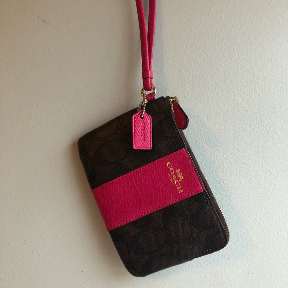 Brown and hot pink Coach signature wristlet